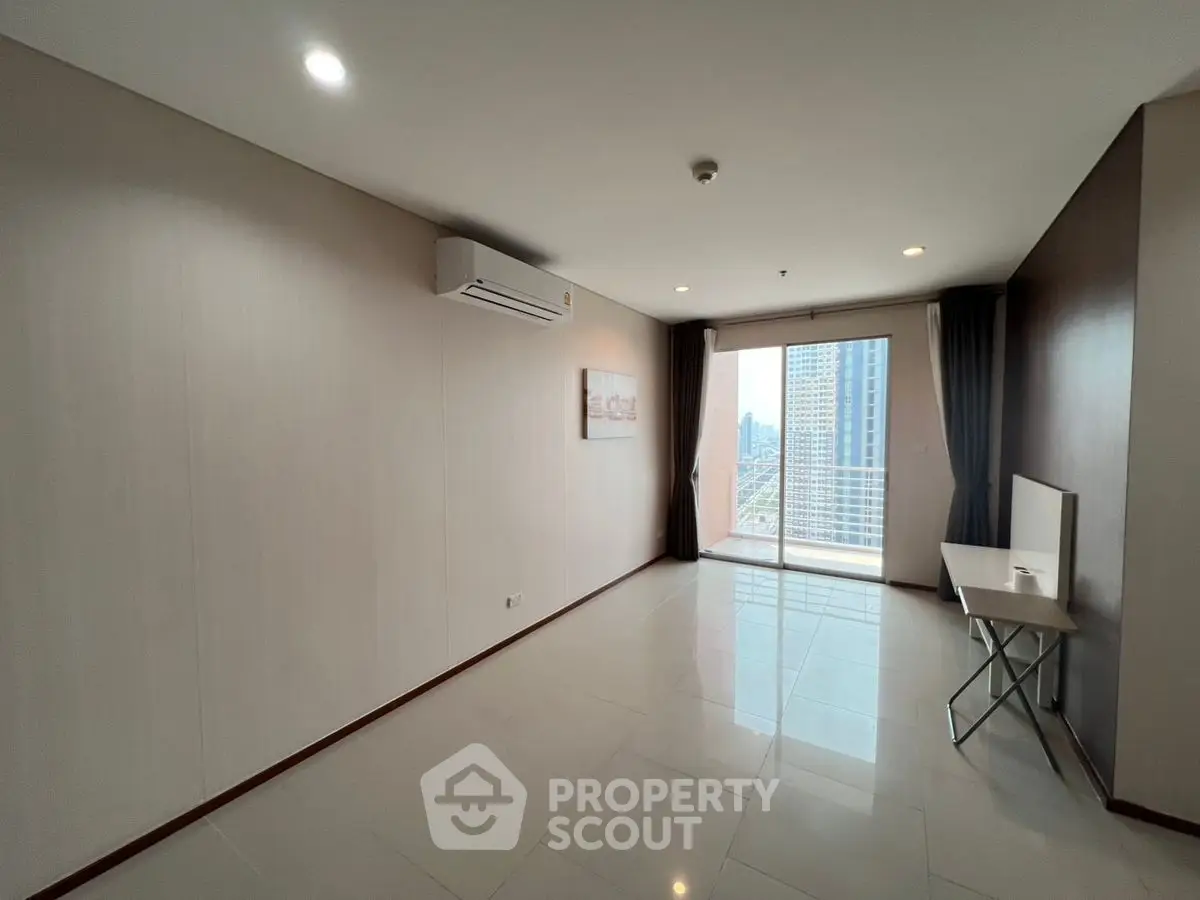 Spacious living room with balcony and city view in modern apartment