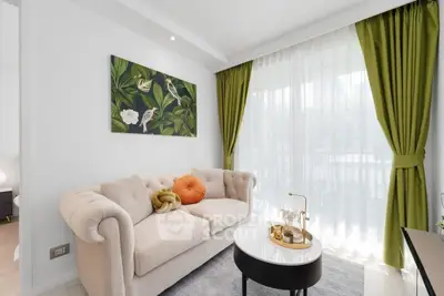 Elegant living room with plush sofa and vibrant green curtains