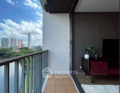 Stunning balcony view with city skyline and river, perfect for relaxation.