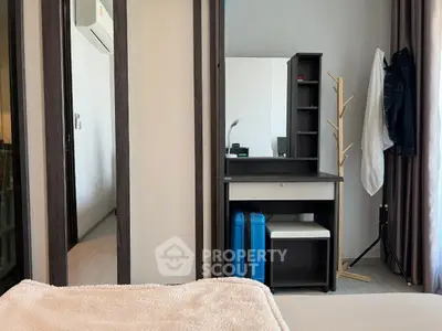 Modern bedroom with stylish vanity and ample natural light