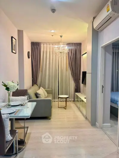 Modern living room with elegant decor and cozy ambiance in a stylish apartment.