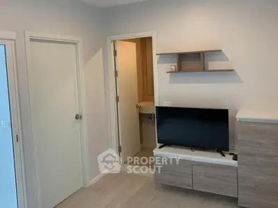 Modern living room with TV and minimalist decor