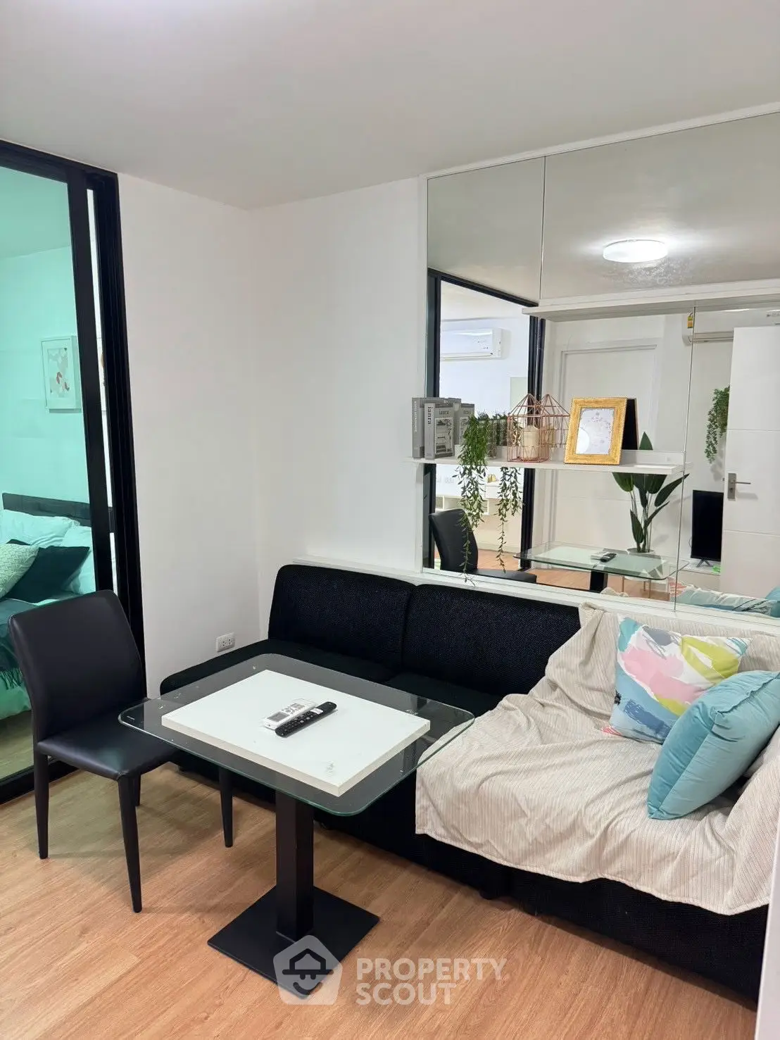Modern living room with cozy sofa and stylish decor in a contemporary apartment.