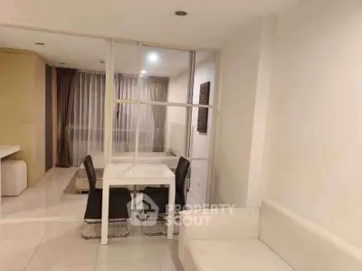 Modern living room with glass partition and elegant dining area