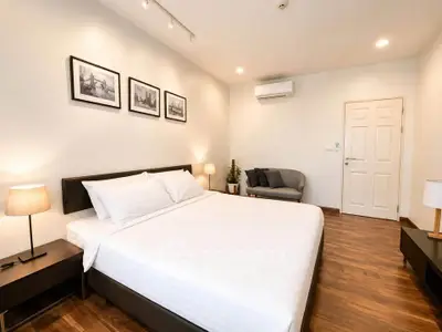 Spacious modern bedroom with elegant decor and cozy lighting