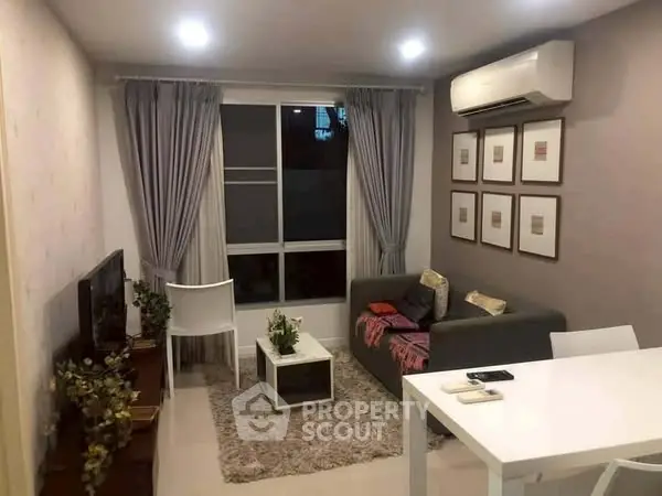 Cozy living room with modern decor, air conditioning, and stylish furniture.