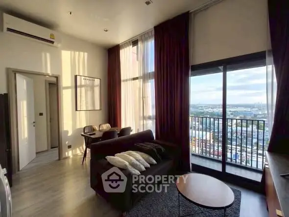 Modern living room with city view and balcony access