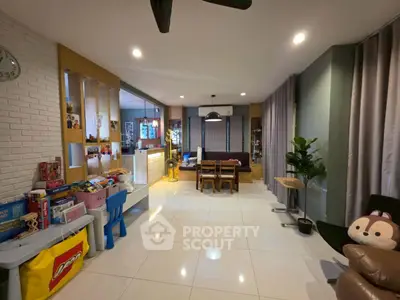 Spacious living room with modern decor and ample natural light