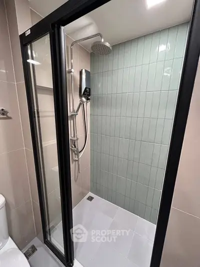 Modern bathroom with sleek shower enclosure and contemporary tile design