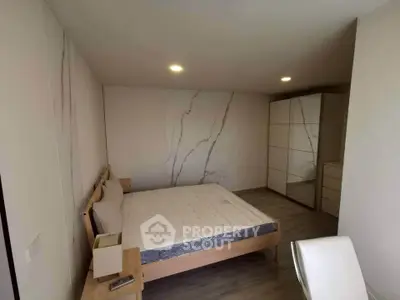 Modern minimalist bedroom with stylish decor and ample storage space