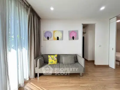 Modern living room with cozy sofa and artistic wall decor