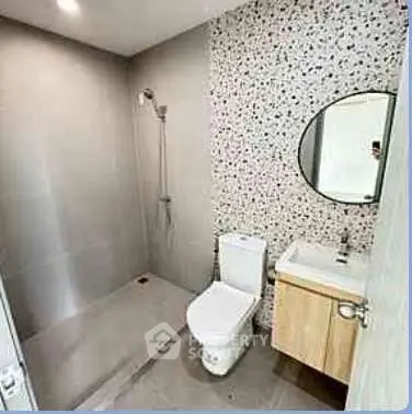 Modern bathroom with sleek design and terrazzo wall accent