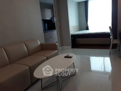 Modern studio apartment with sleek furniture and natural light