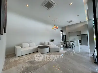 Spacious modern living room with open kitchen and elegant decor