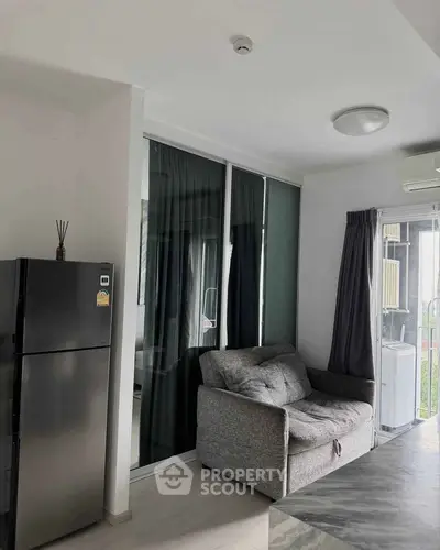Modern apartment interior with cozy living area and sleek kitchen design.