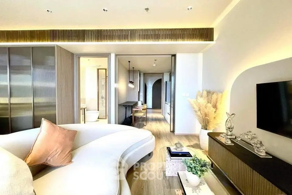 Luxurious modern living room with elegant curved sofa and stylish decor