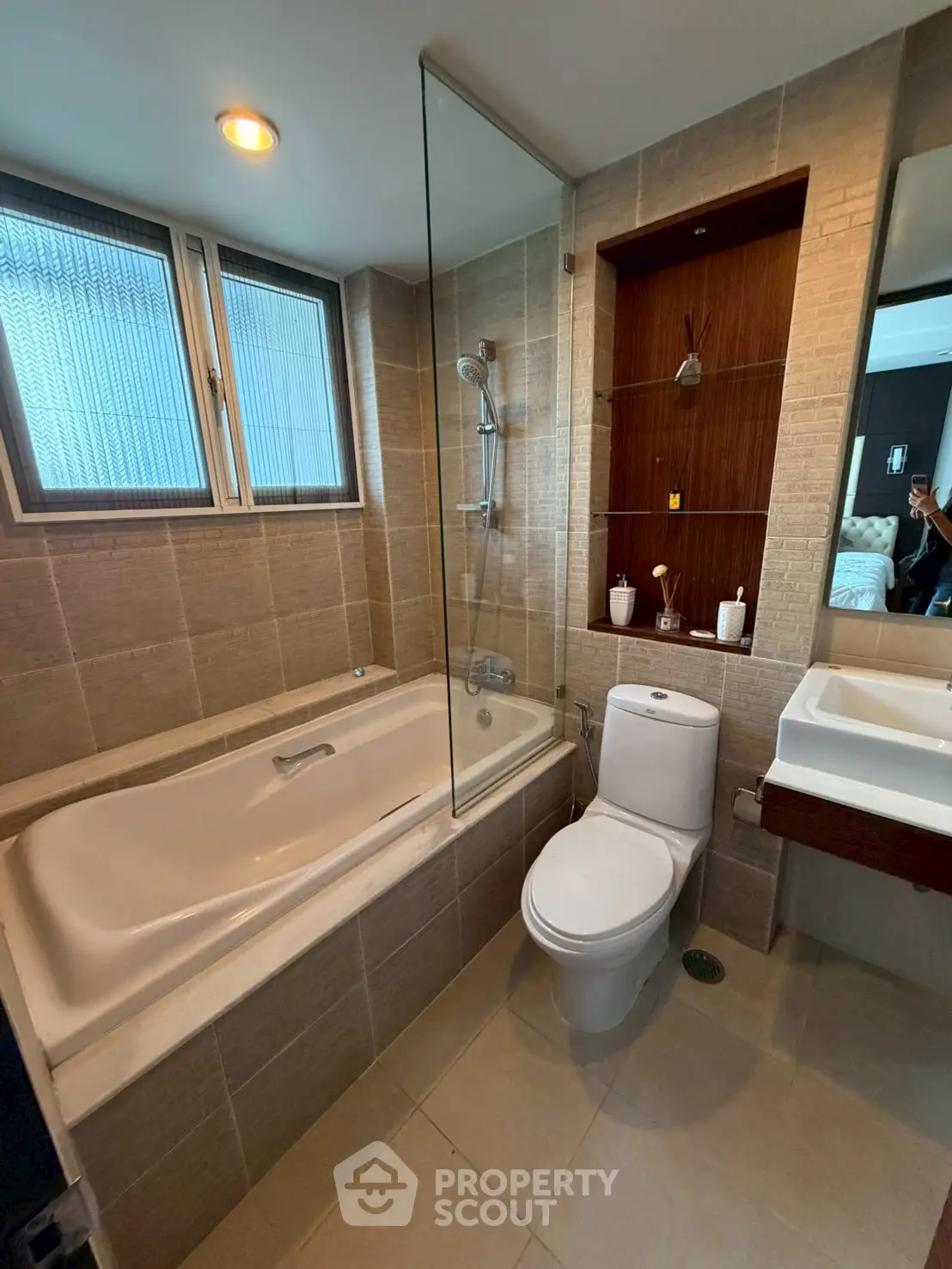 Modern bathroom with bathtub and sleek fixtures in a contemporary apartment.