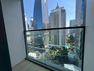 Stunning cityscape view from a modern balcony in a high-rise building.