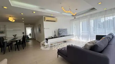 Spacious modern living room with elegant decor and city view balcony