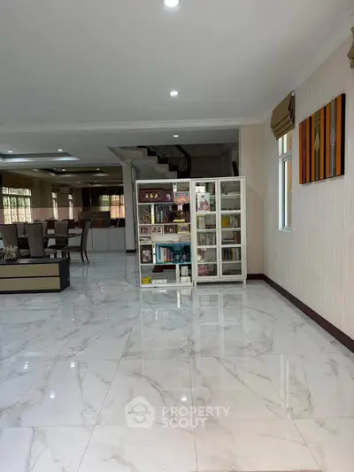 Spacious living room with marble flooring and elegant decor