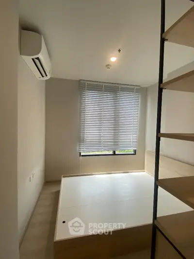 Modern minimalist bedroom with built-in bed and air conditioning