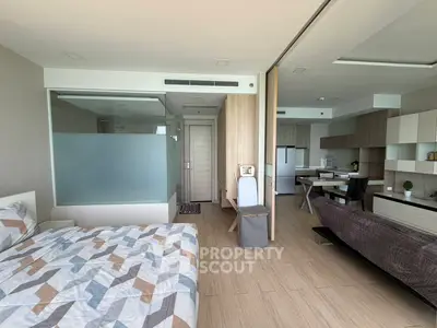 Modern open-plan studio apartment with stylish decor and natural light