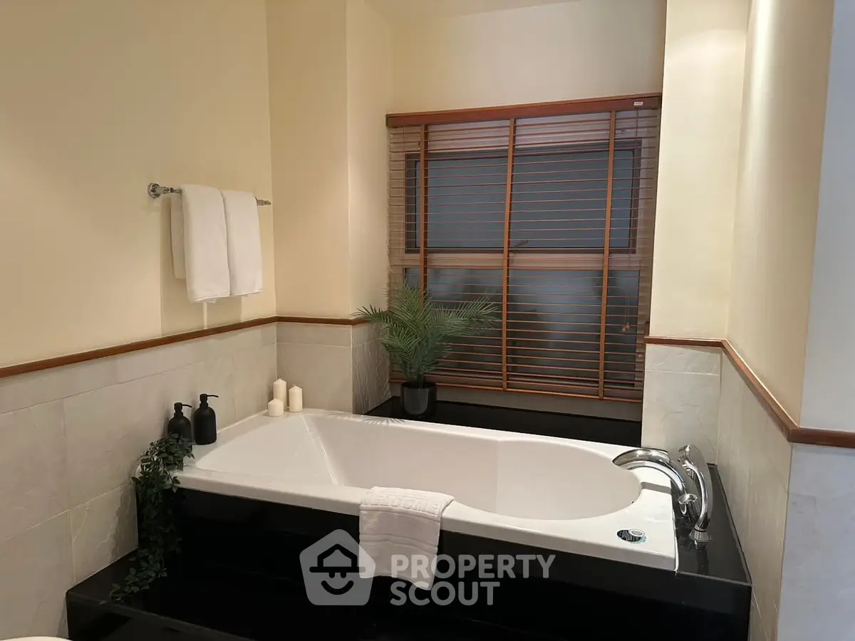 Luxurious bathroom with elegant bathtub and stylish decor