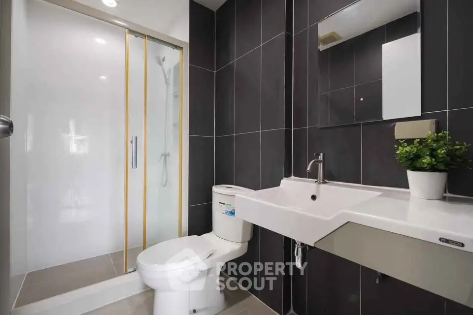 Modern bathroom with sleek design and glass shower enclosure