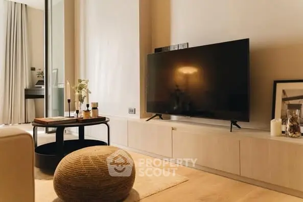 Modern living room with large TV and stylish decor
