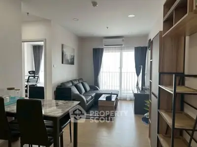 Modern living room with stylish furniture and natural light in a contemporary apartment.