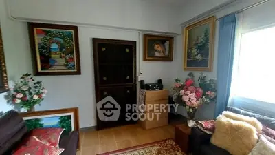 Charming living room with elegant decor and floral arrangements