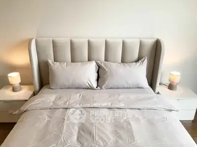Elegant bedroom with plush headboard and cozy bedding