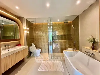 Luxurious modern bathroom with glass shower and elegant bathtub