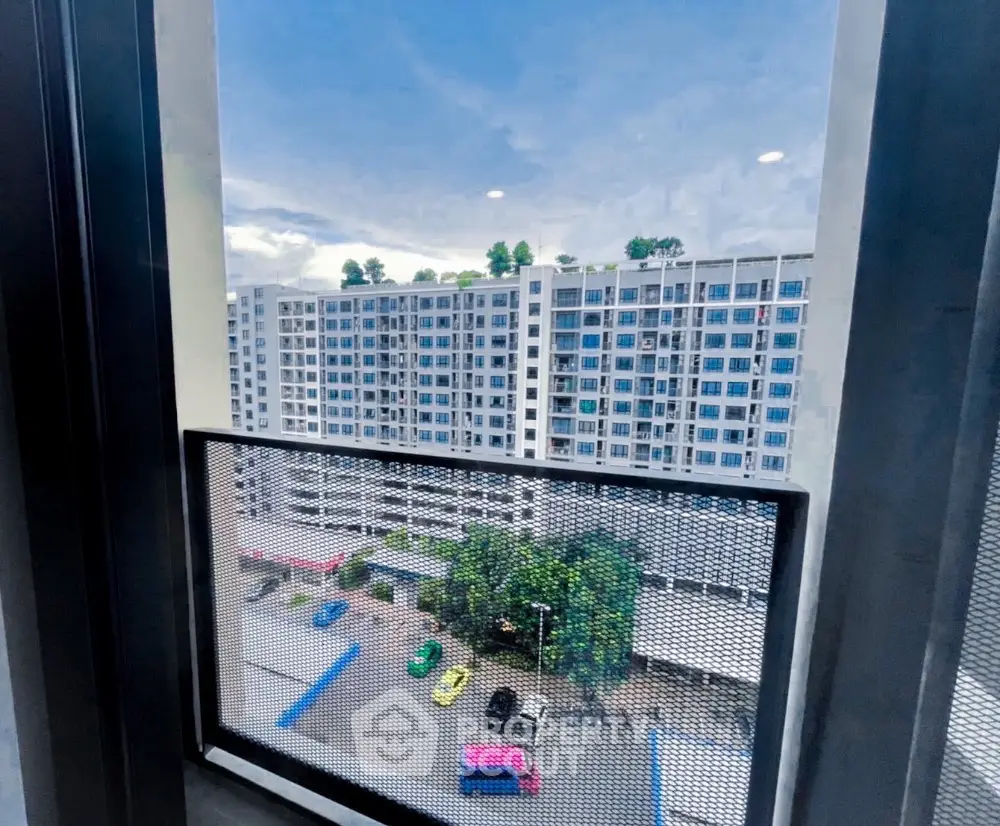 Stunning cityscape view from high-rise apartment window with vibrant skyline.