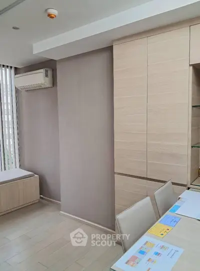 Modern study room with sleek cabinetry and natural light
