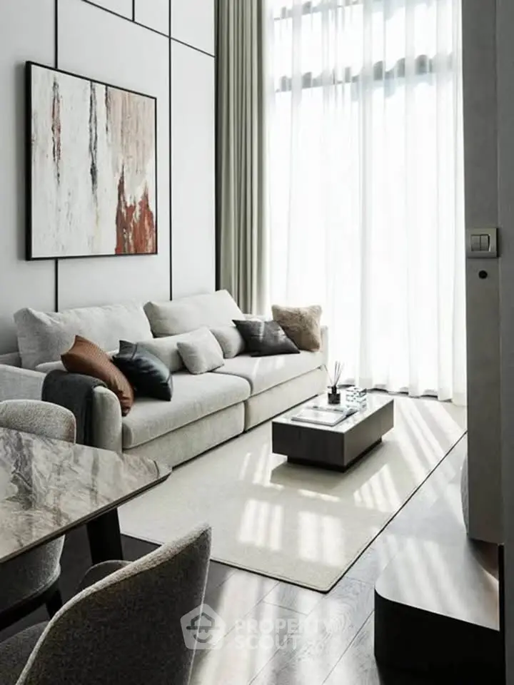Modern living room with elegant decor and large windows for natural light.