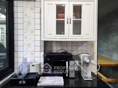 Modern kitchen with sleek appliances and stylish cabinetry, perfect for culinary enthusiasts.