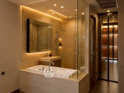 Luxurious modern bathroom with glass shower and elegant lighting