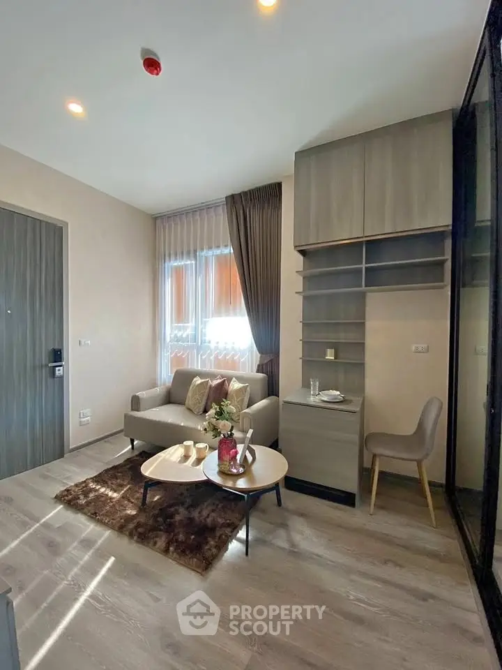 Modern living room with stylish furniture and natural light, perfect for urban living.