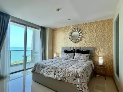 Luxurious bedroom with ocean view and elegant decor in high-rise apartment