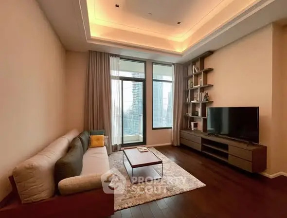 Modern living room with elegant lighting and city view, featuring a cozy sofa and sleek entertainment unit.