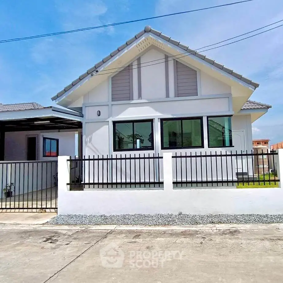 Charming modern house with a sleek exterior and fenced yard, perfect for family living.