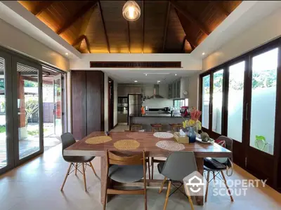 Stunning open-layout kitchen and dining area with modern design and natural light.