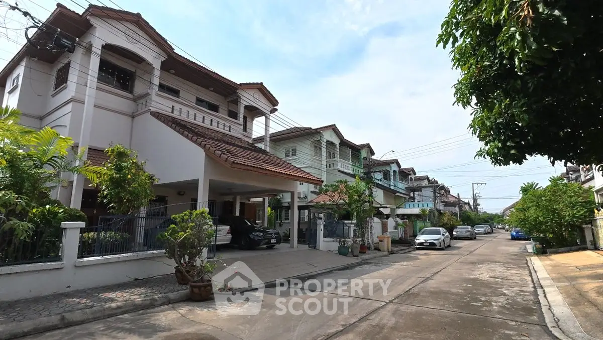 Charming suburban street with modern houses and lush greenery, perfect for family living.