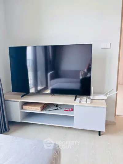 Modern living room with sleek TV setup and stylish furniture