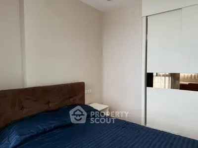 Cozy bedroom with modern design and ample natural light