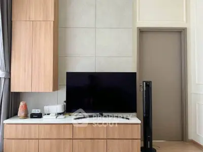 Modern living room with sleek TV setup and stylish wooden cabinetry