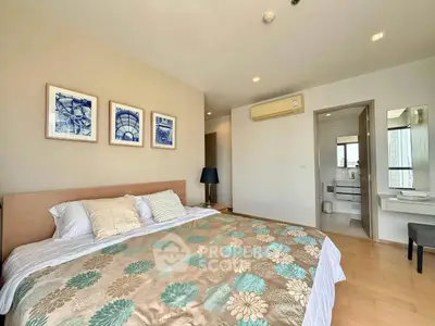 Spacious bedroom with ensuite bathroom and modern decor in a luxury apartment.