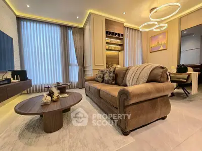 Luxurious living room with elegant decor and modern lighting, perfect for relaxation and entertainment.