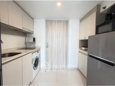 Modern kitchen with sleek cabinetry and built-in appliances